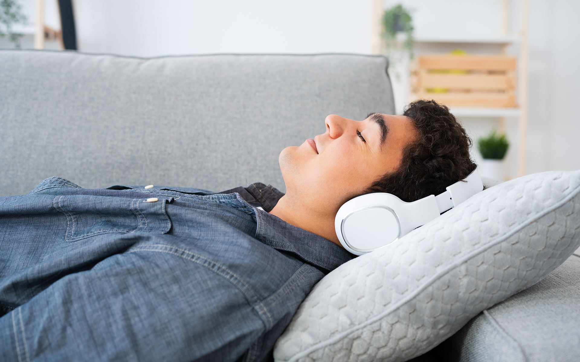 12 Minute Meditation: A Guided Visualization Meditation to Fill Your Cup12 Minute Meditation - teen boy lays on the couch with white headphones on.