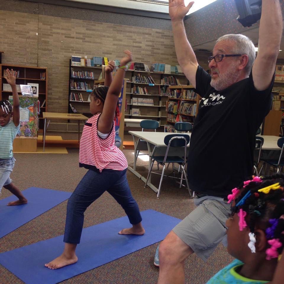 Students and teacher doing yoga - mindfulness in schools