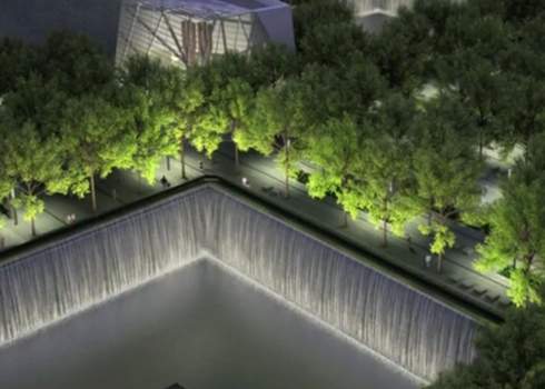 An aerial view of a waterfall in the middle of a city.