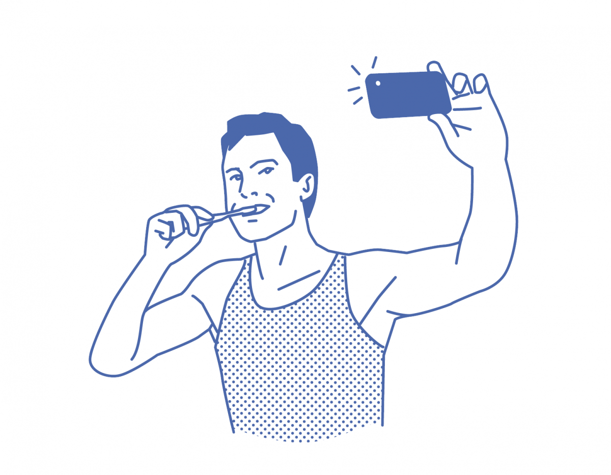 Man taking selfie while brushing his teeth
