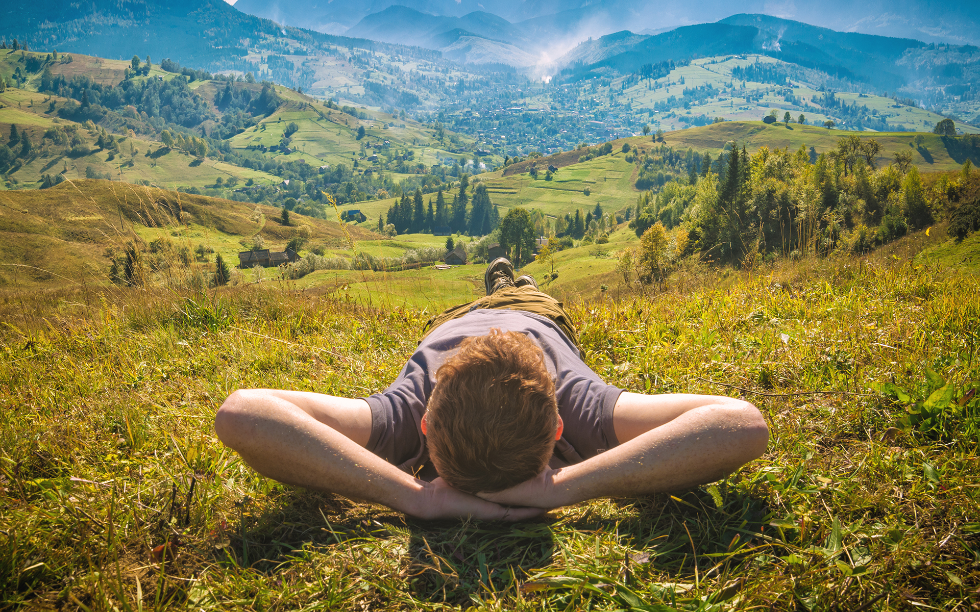Summer Meditation Retreat: 6 Mindfulness Practices for Self-Care - Young red hair man lying on a hill
