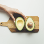woman eating avocado