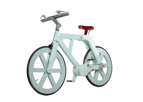A white bicycle with a red seat and wheels.