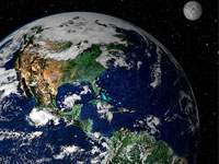 The earth from space with the moon in the background.