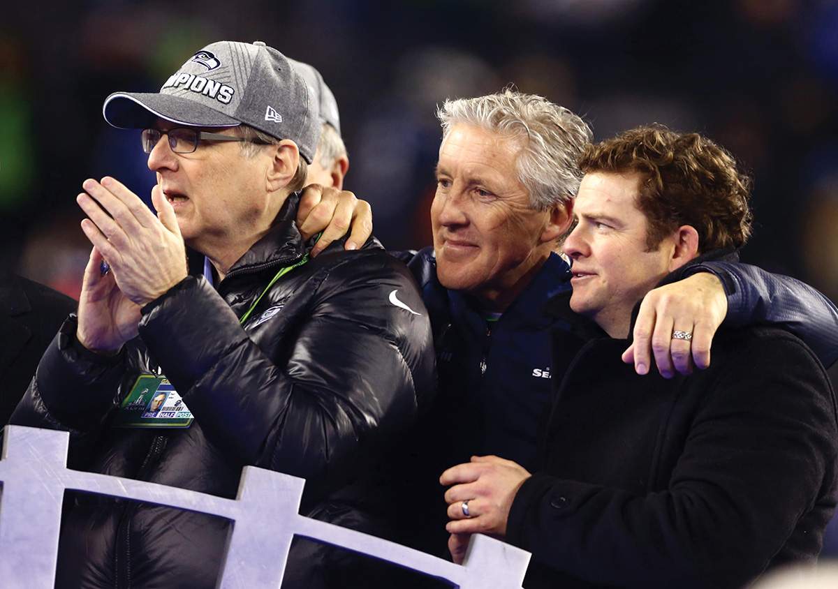 Coach Carroll (middle) savors Super Bowl XLVII win with team owner Paul Allen (left) and general manager John Schneider (right), February 2, 2014.