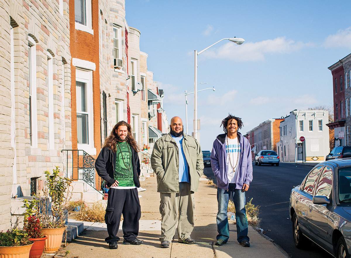 Andy Gonzalez, Ali Smith, and Atman Smith in West Baltimore, where most of HLF’s programs take place.