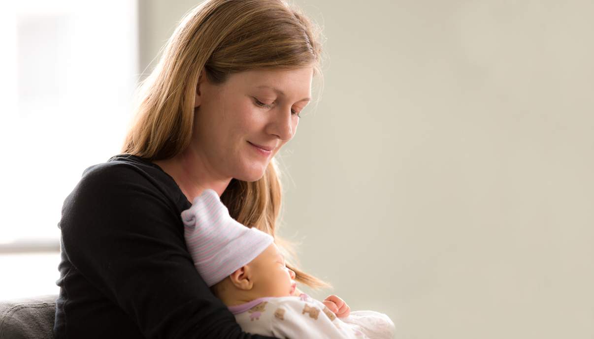 mom holding baby