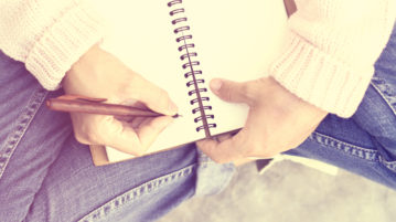 The Simple Joy of Writing by Hand person writing in notebook