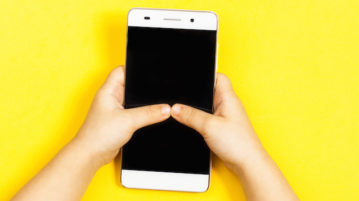 Getting Kids Unhooked from Their Smartphones hands of kid playing on smartphone
