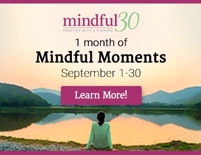 woman sitting looking out at water mindful30 promo
