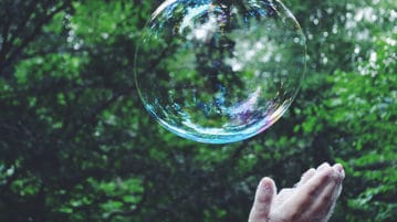 A Mindful Kids Practice: The Breath Ball Hands reaching to bubble