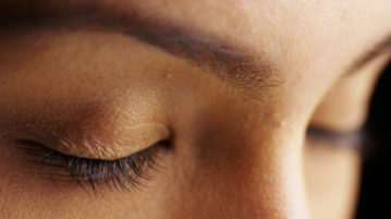 How Mindfulness Helps You Cultivate a Teflon Mind women eyes closed on black background