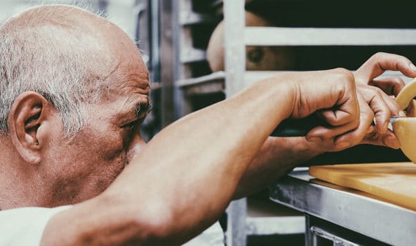 Does Meditation Boost Creativity? man carving cheese in Montreal