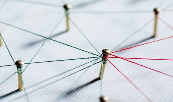 Three Simple Soft Skills to Make a Habit of at Work Thumbtacks linked together by red thread