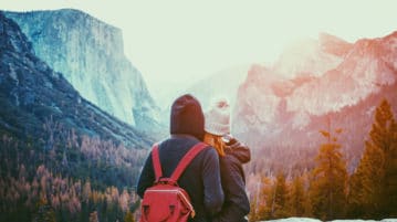 How Awe Brings People Together couple standing together in Yosemite National Park, California USA