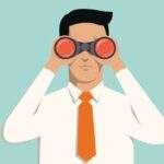 How to Avoid Confirmation Bias at Work man in suit with binoculars