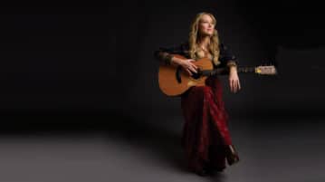 Singer-Songwriter Jewel Shares Her Mindfulness Practices Singer Jewel with guitar