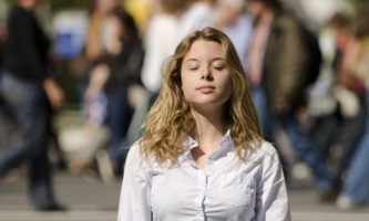 woman meditating in public