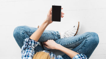 Free Mindfulness Apps Worthy of Your Attention woman looking at phone