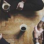 How Mindfulness Gives You an Edge at Work people sitting on floor drinking coffee