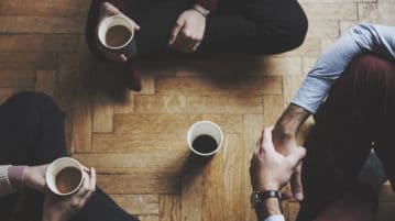 How Mindfulness Gives You an Edge at Work people sitting on floor drinking coffee
