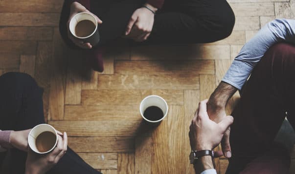 How Mindfulness Gives You an Edge at Work people sitting on floor drinking coffee