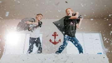 The Key to Raising Resilient Children children having a pillow fight