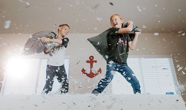 The Key to Raising Resilient Children children having a pillow fight