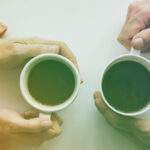 Why You Should Take a Relaxing Lunch Break man and woman drinking coffee together aerial view