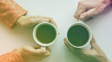 Why You Should Take a Relaxing Lunch Break man and woman drinking coffee together aerial view