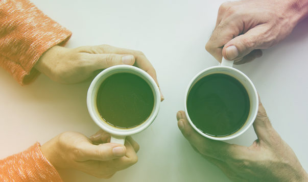 Why You Should Take a Relaxing Lunch Break man and woman drinking coffee together aerial view