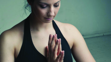 Using Yoga to Stretch the Mind Woman doing yoga